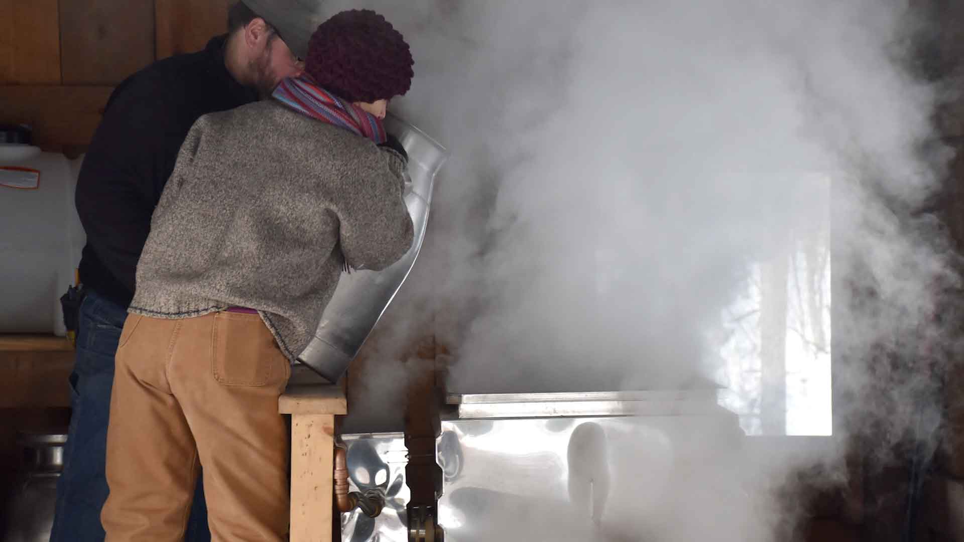 People making maple syrup in the Sugar Shack at Shaver's Creek