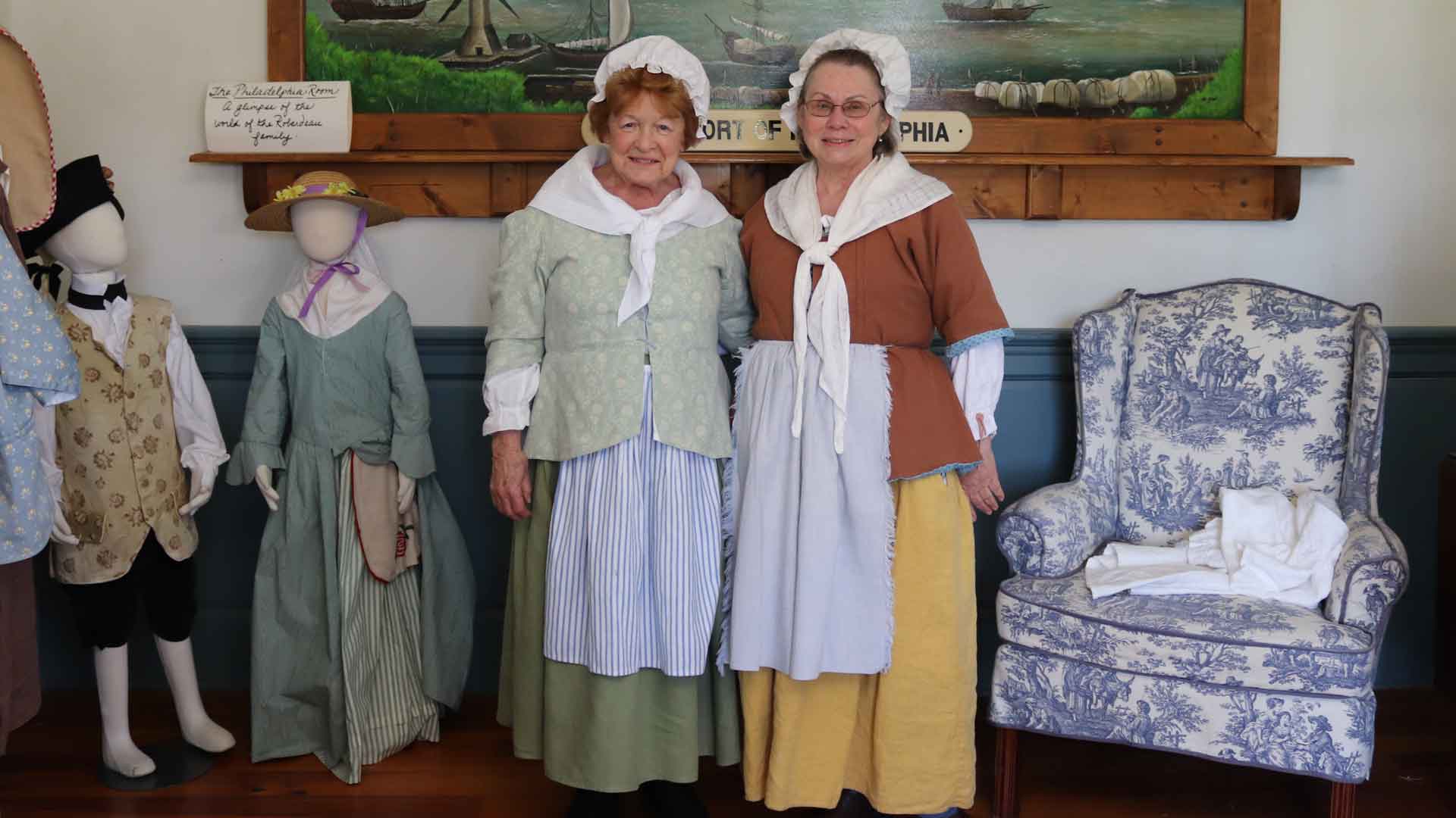 women dressed in colonial era clothing