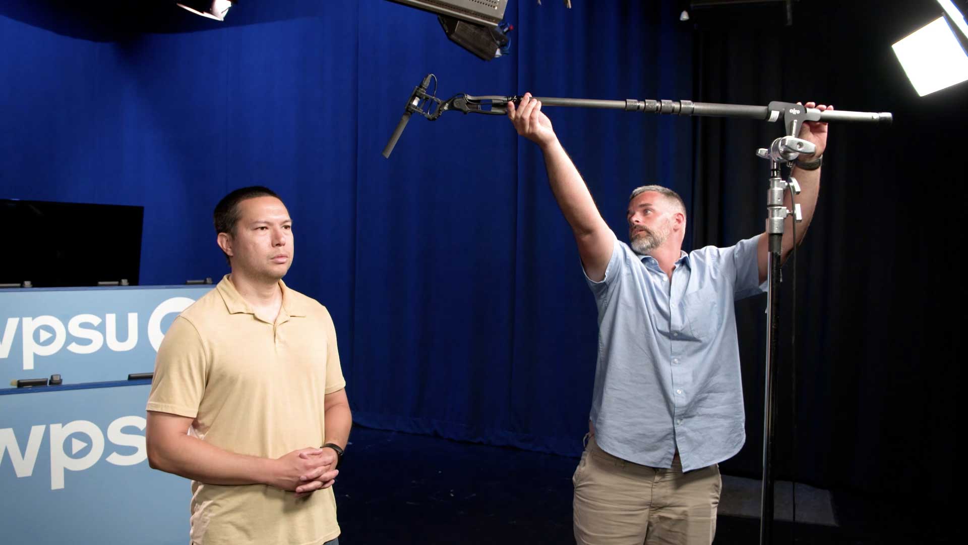 WPSU producer setting up boom mic