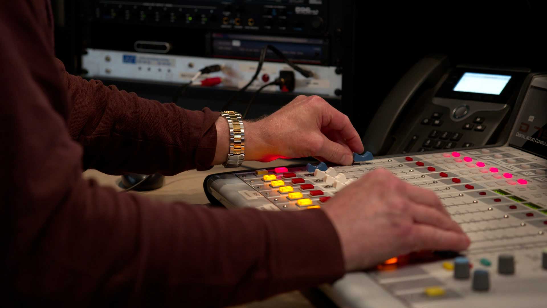 persons hands operating a switcher