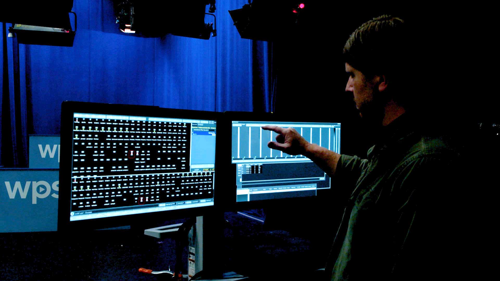 WPSU technician touching computer screen