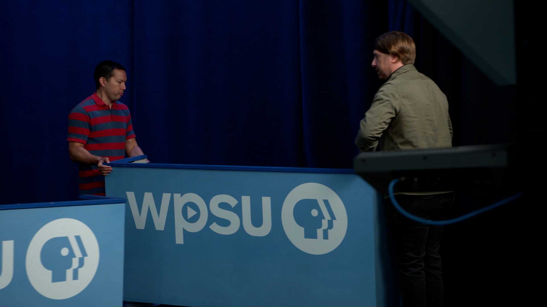 WPSU technicians moving set pieces