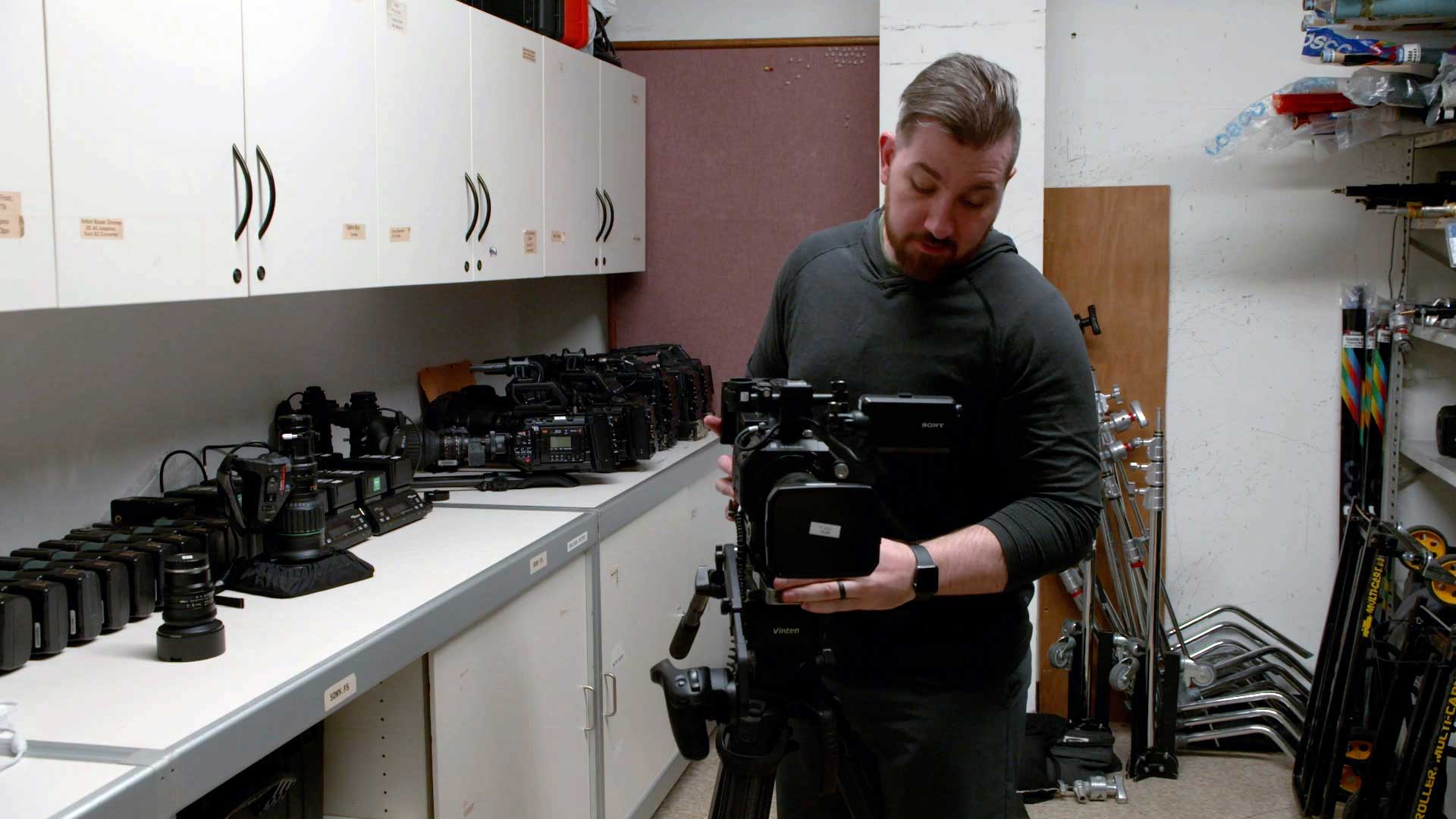 WPSU videographer adjusting a video camera